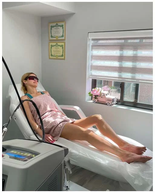 Woman lying on a table during a beauty treatment